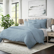 Elegant bedroom featuring Elsie cornflower blue comforter set with decorative pillows